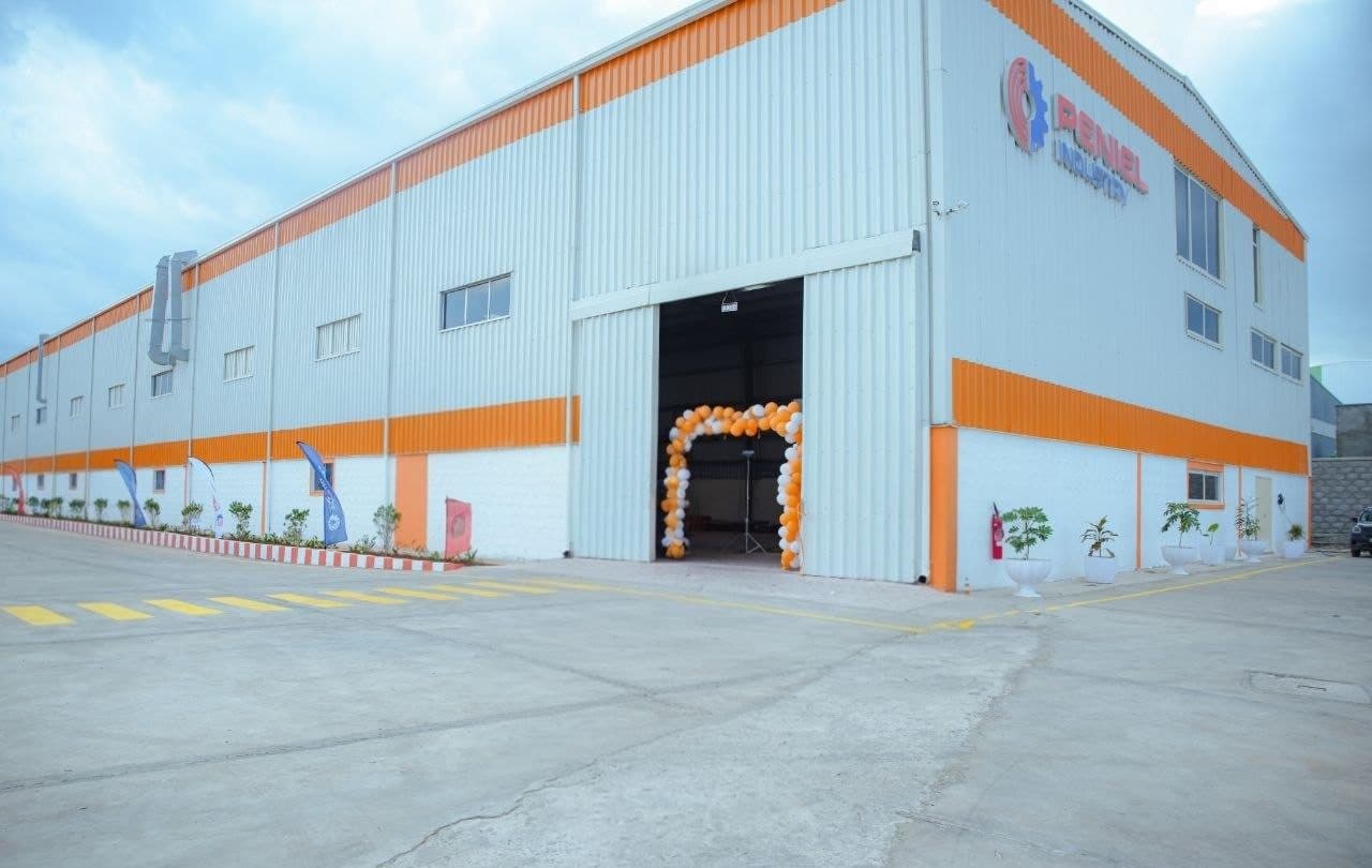 Peniel Industry PLC facility exterior with entrance arch, Bole Lemi Industrial Park